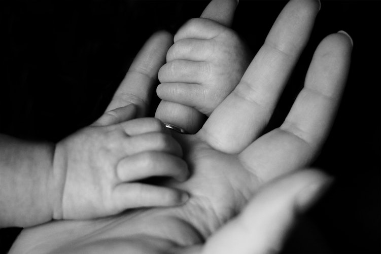 Mother and baby hands